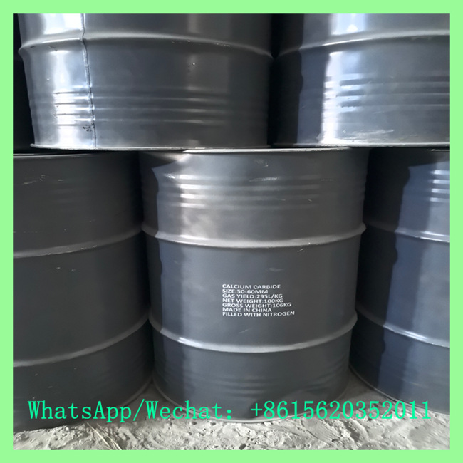Close-up of 100kg calcium carbide drum showing size 50-60mm and gas yield specifications