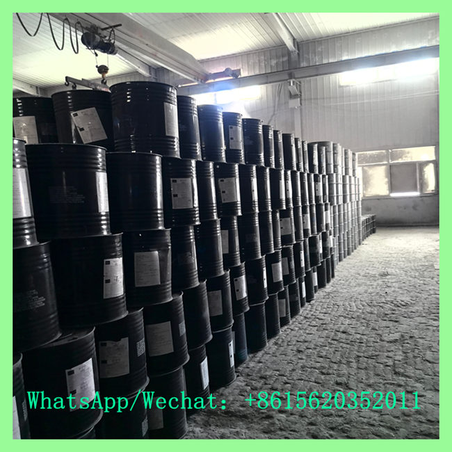 Black metal calcium carbide 50kg drum inventory stacked neatly inside warehouse