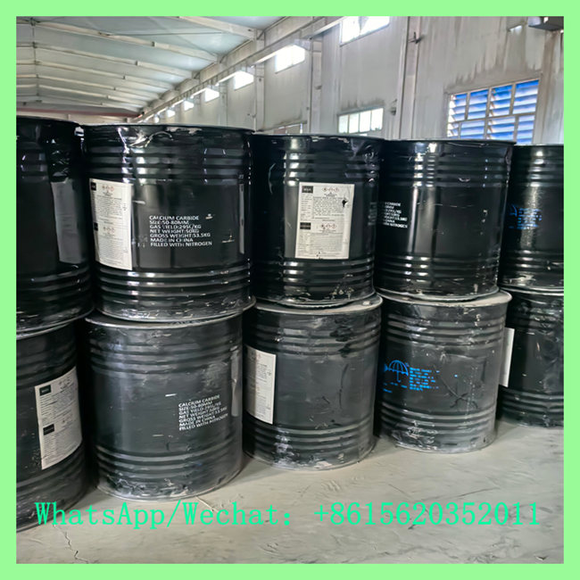Airtight calcium carbide 50kg drum stacked in factory with specification labels