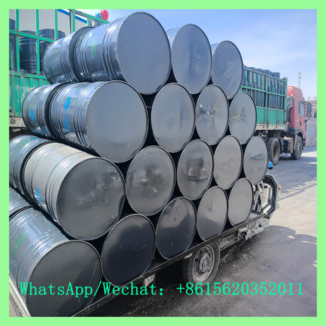 Heavy-duty transport truck loaded with chemical drums supplied by calcium carbide supplier