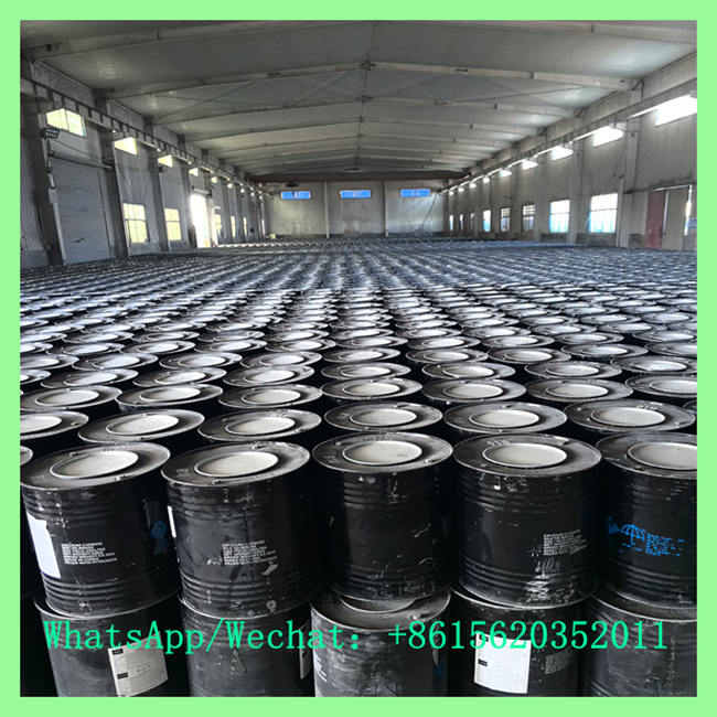 Massive warehouse filled with rows of UN-certified steel drums packed with 15-25mm calcium carbide for export. WhatsApp/Wechat: +8615620352011
