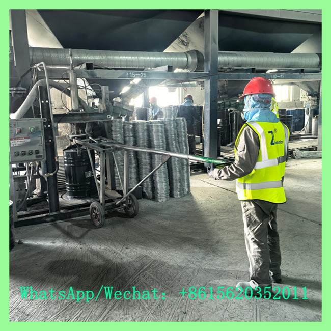 Factory operator in high-visibility safety vest managing 15-25mm calcium carbide drum sealing and processing equipment. WhatsApp/Wechat: +8615620352011