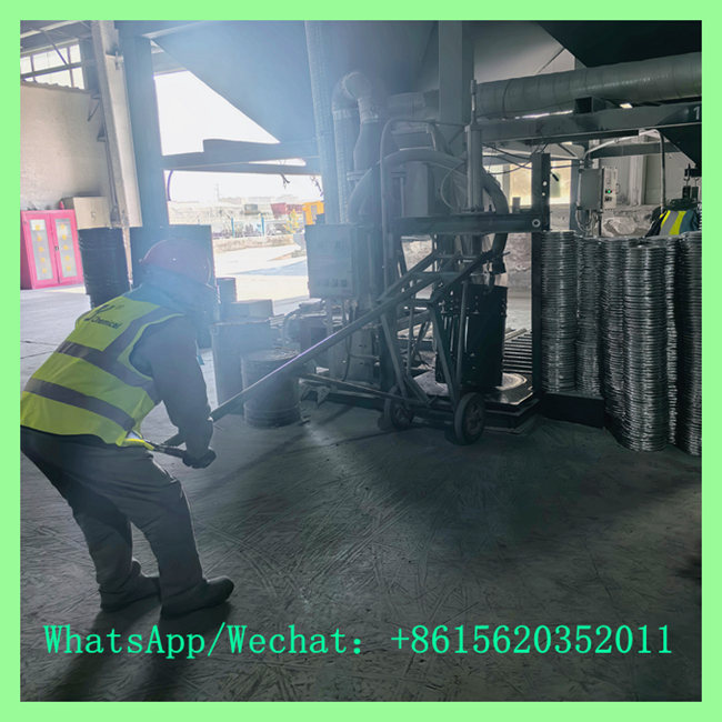 Industrial worker in safety gear opertating machinery to process or pack chemical materials in a factory setting. WhatsApp/Wechat: +8615620352011