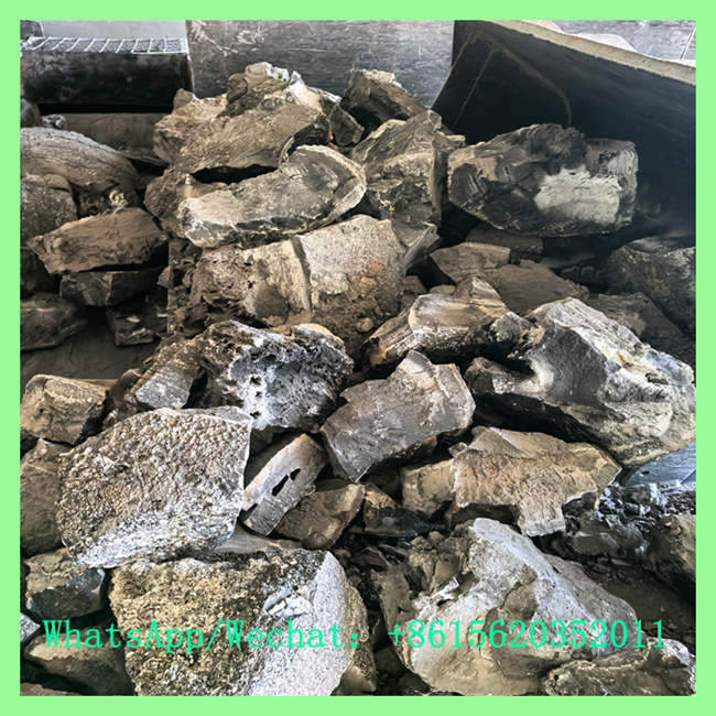 Close-up of raw industrial calcium carbide lumps, showing their natural grey and crystalline rock-like texture before processing. Call +8615620352011