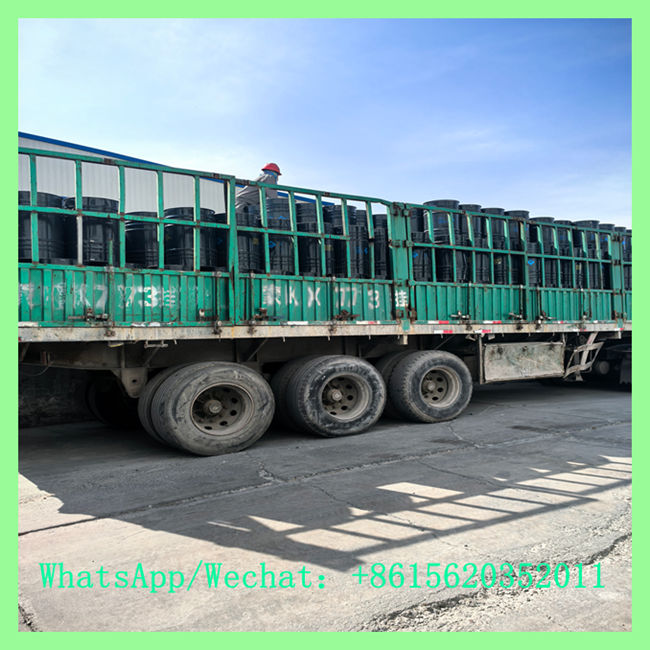 Heavy-duty transport truck loaded with steel drums containing industrial calcium carbide 7-15mm for export. WhatsApp/Wechat: +8615620352011