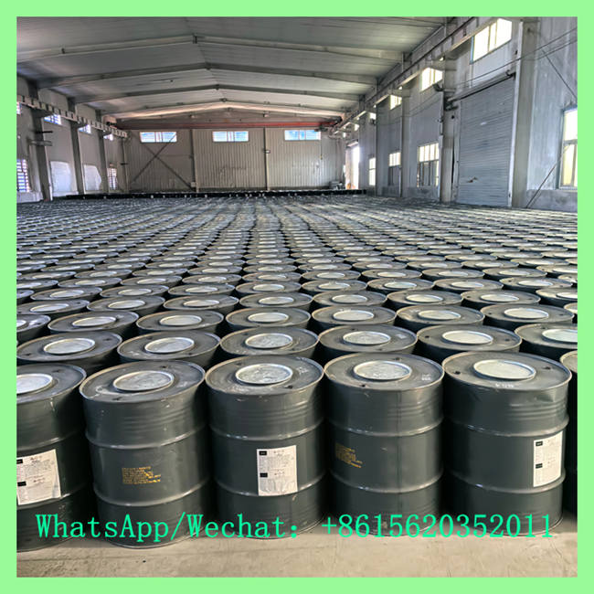 Large warehouse facility with neat rows of sealed steel drums for wholesale calcium carbide crystals export