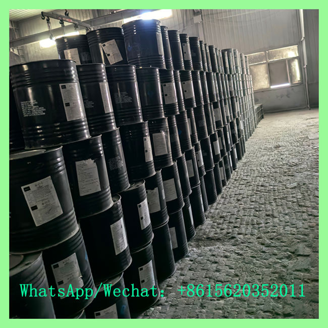 Bulk storage facility with rows of black chemical drums prepared for international shipping at low china calcium carbide price