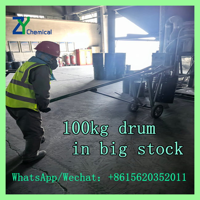 Factory Operator Transporting 100kg Drum Calcium Carbide for Logistics Delivery
