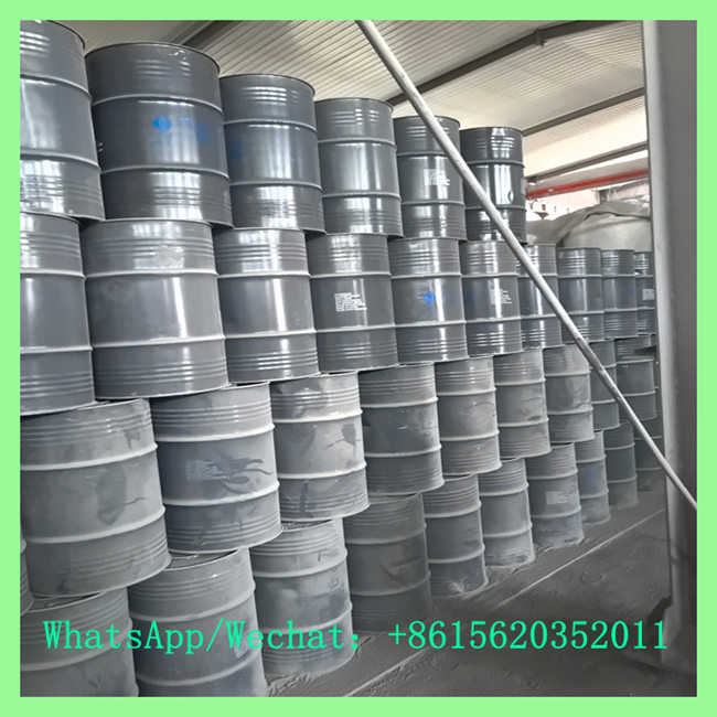 Warehouse storage of stacked metal drums filled with wholesale calcium carbide 50-80mm