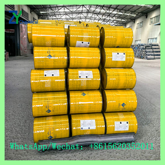 Palletized stack of customized yellow steel drums labeled for optimal calcium carbide 1kg price bulk supply