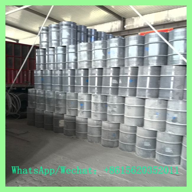 Bulk stock of export steel drums with China calcium carbide 50-80mm loaded near delivery truck