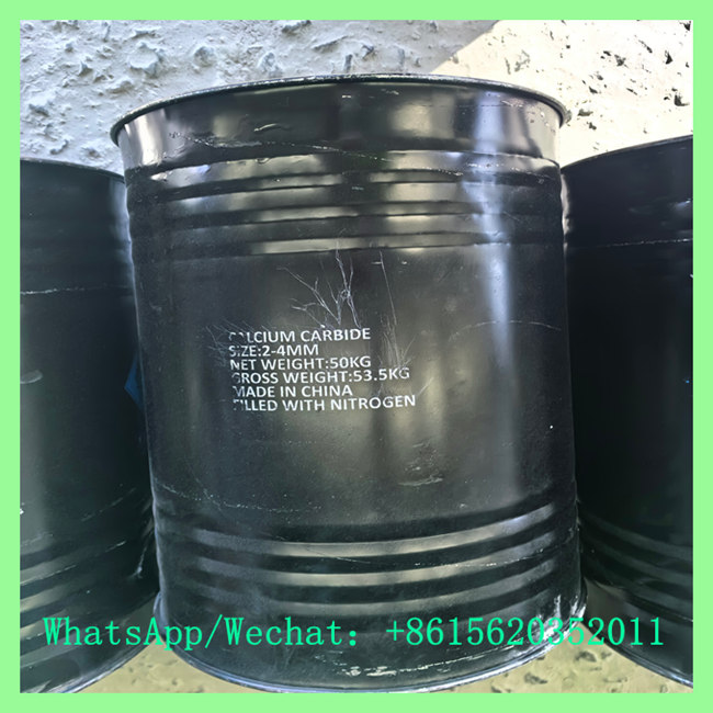 Close-up of 50kg nitrogen-filled steel drum labeled 2-4mm calcium carbide powder price product