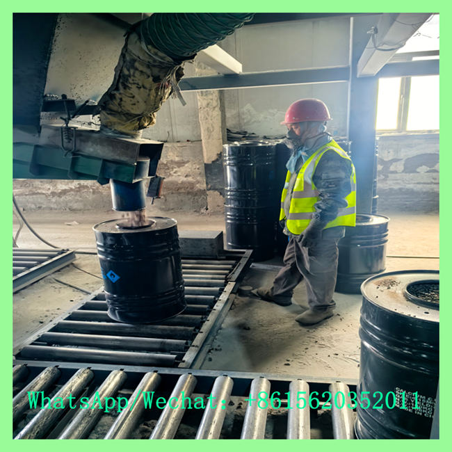 Factory worker operating filling line for safe chemical packaging and use of calcium carbide