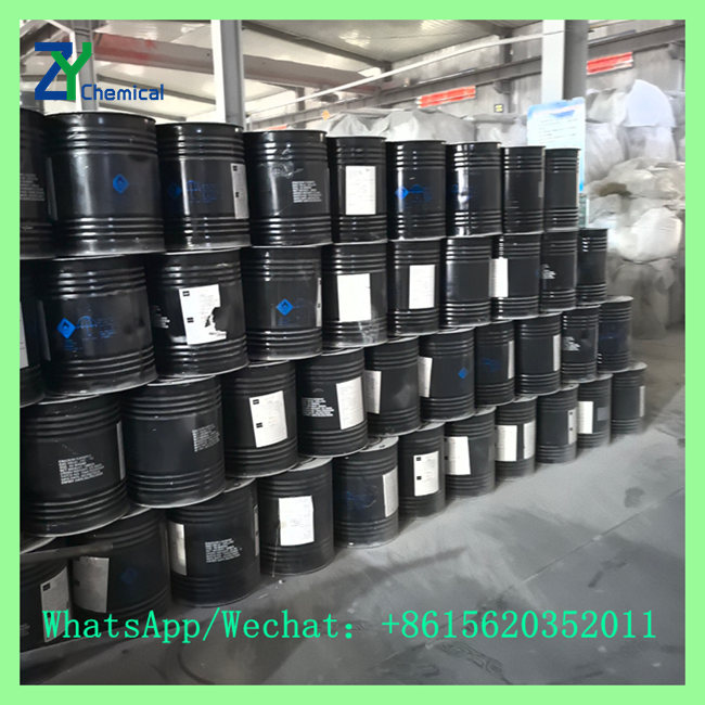 Factory warehouse with stacked black drums of calcium carbide near me for local wholesale