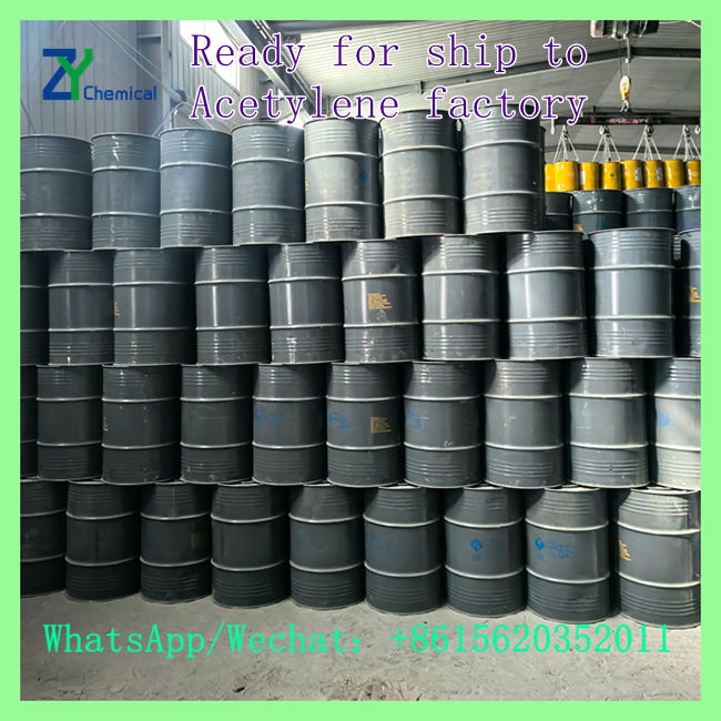 High-purity acetylene calcium carbide steel drums neatly stacked in warehouse ready for factory shipment