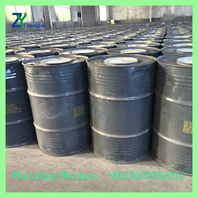 Close-up view of sealed 100kg steel drums containing CaC2 acetylene grade calcium carbide for export wholesale