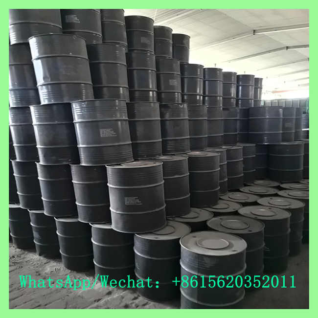 Factory warehouse filled with rows of CaC2 acetylene calcium carbide drums for large-scale industrial acetylene gas generation