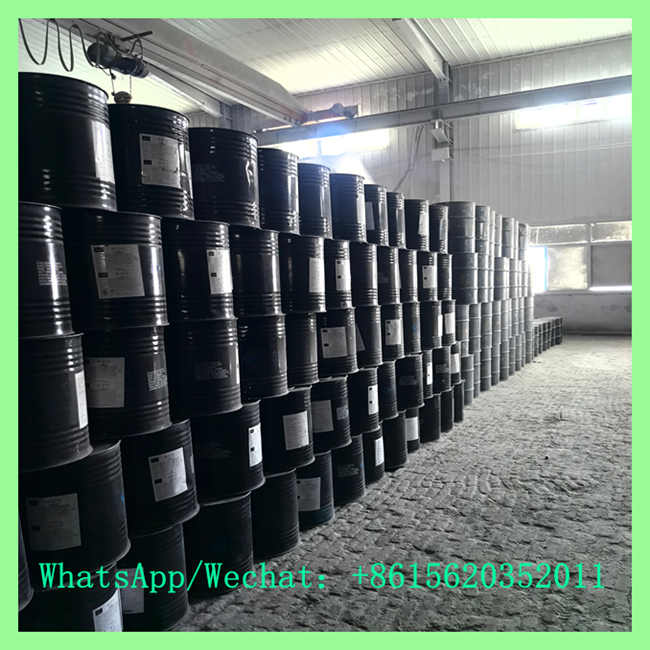 Massive warehouse storage of black steel drums containing industrial cac2 calcium carbide for bulk export