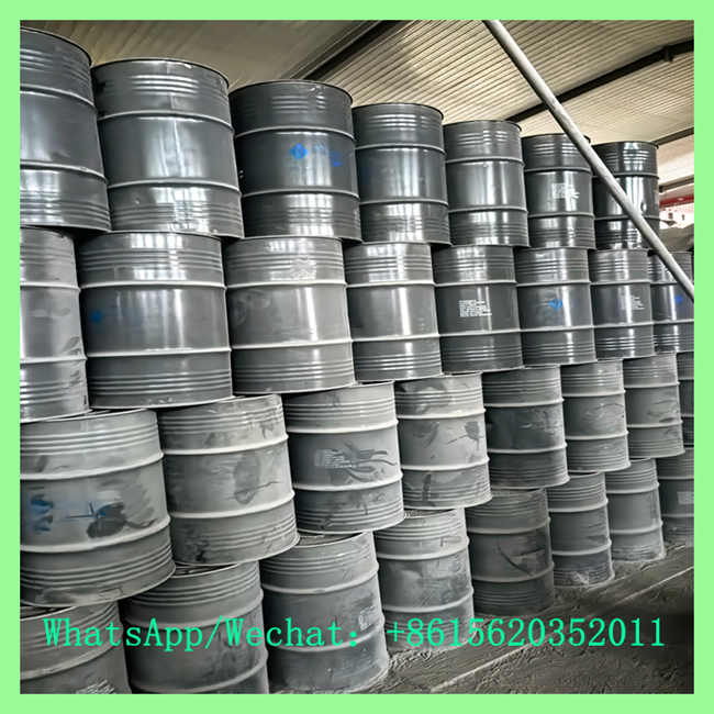 Industrial warehouse area with neatly stacked gray steel drums of raw cac2 calcium carbide for gas production