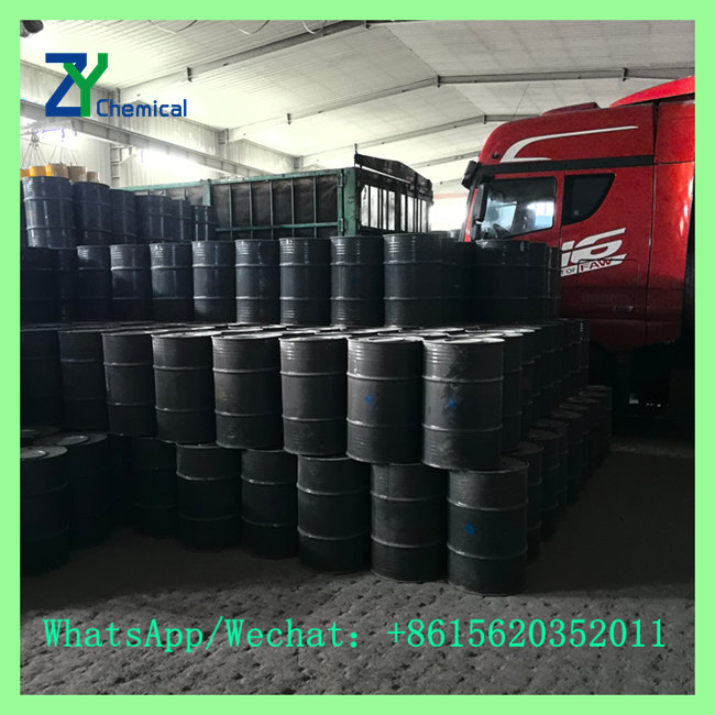 Bulk supply of calcium carbide CaC2 drums being loaded near transport truck for factory dispatch