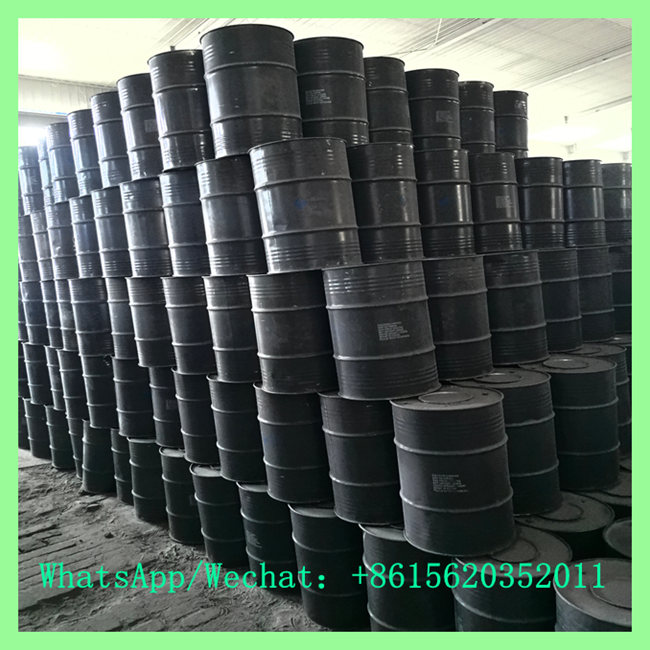 Stack of export-grade solid calcium carbide metal drums prepared for bulk international shipping