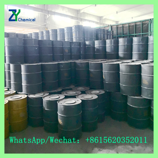 Bulk stock of solid calcium carbide drums stored in factory warehouse for industrial gas and steelmaking supply